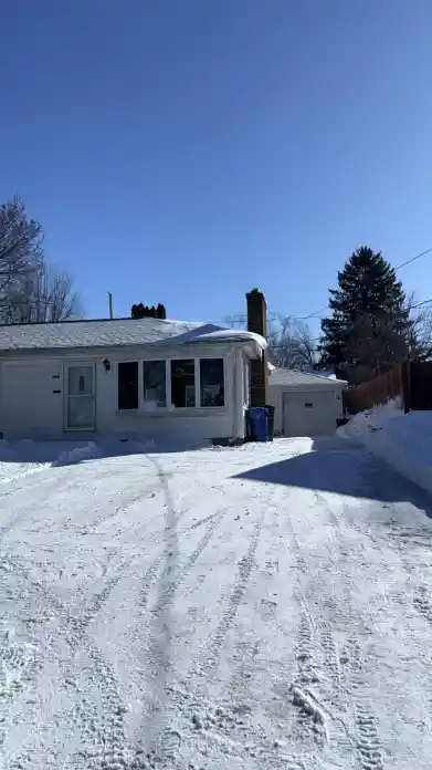 Residential driveway cleared after snow removal